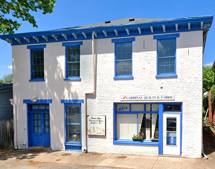 Cardinal Quilts & Fabrics at 108 W Pike Street, Vevay, Indiana — white building with blue painted trim